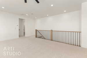 Spare room with recessed lighting, light colored carpet, and a ceiling fan