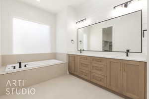 Bathroom with double vanity, a bath, and tile patterned flooring