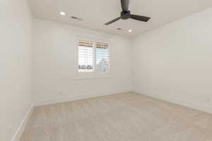 Unfurnished room with light colored carpet, recessed lighting, and ceiling fan