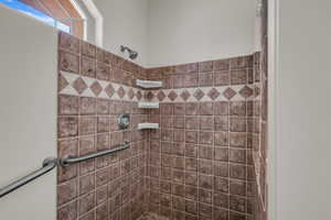 Full bathroom with tiled shower