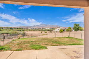 View of yard with a mountain view and a rural view