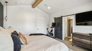 Bedroom with a barn door, light colored carpet, and recessed lighting