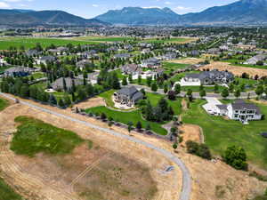 Aerial perspective of suburban area with a mountainous background