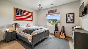 Bedroom with light colored carpet