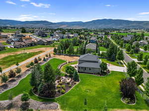 Aerial perspective of suburban area featuring a mountainous background