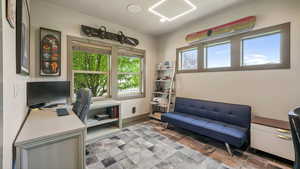 Home office featuring stone finish floors and recessed lighting
