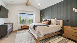 Carpeted bedroom with an accent wall and wallpapered walls