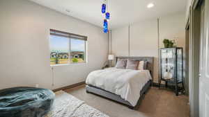 Carpeted bedroom featuring baseboards and recessed lighting