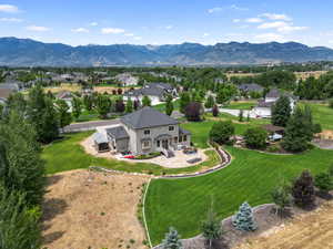 Aerial perspective of suburban area featuring a mountain backdrop