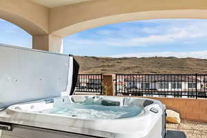 View of patio featuring a hot tub