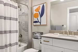 Bathroom featuring vanity and shower / tub combo
