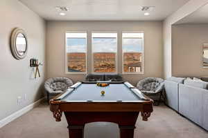 Game room featuring light colored carpet, plenty of natural light, billiards, and recessed lighting