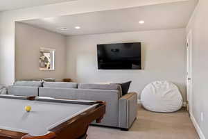Playroom with recessed lighting and light colored carpet