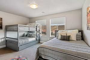 Carpeted bedroom with baseboards