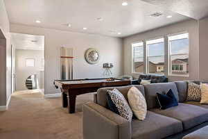 Recreation room with light carpet, recessed lighting, and pool table
