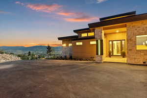 View of front of home featuring stone siding and a mountain view