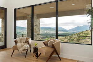 Living area featuring a mountain view, recessed lighting, and light wood-style floors