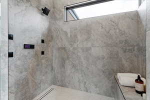 Full bathroom featuring tiled shower