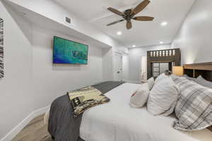 Bedroom featuring recessed lighting, wood finished floors, and a ceiling fan