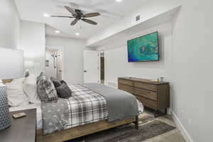 Primary Bedroom with recessed lighting, wood finished floors, and a ceiling fan