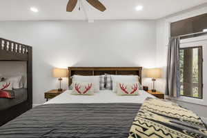 Bedroom with ceiling fan, recessed lighting, and beam ceiling