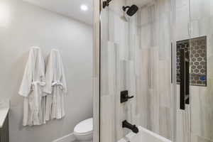 Bathroom with bathtub / shower combination and vanity