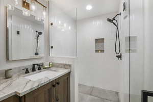 Primary Bathroom featuring vanity and a walk in shower
