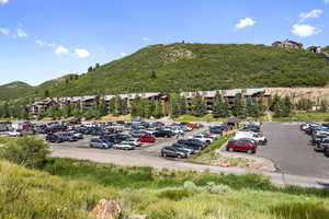 Uncovered parking lot with a mountain view looking toward subject property