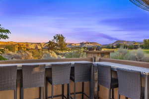Balcony at dusk with a mountain view