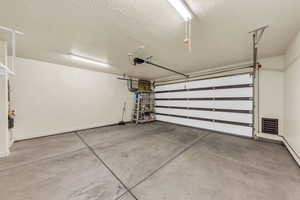 Garage featuring baseboards