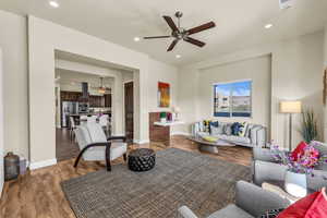 Living area featuring ceiling fan, wood finished floors, and recessed lighting