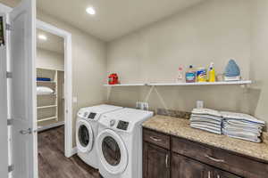 Laundry area featuring separate washer and dryer, dark wood-style floors, and recessed lighting