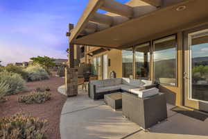View of patio with an outdoor hangout area