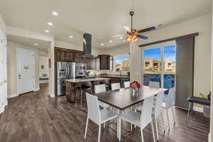 Dining room featuring recessed lighting, dark wood-style floors, and a ceiling fan