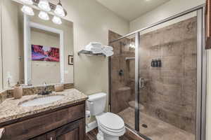 Bathroom with vanity and a stall shower