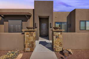 Doorway to property with stucco siding