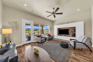 Living room featuring ceiling fan, recessed lighting, and wood finished floors