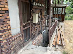 Entrance to property with brick siding