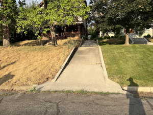 View of front of home featuring a front yard and brick siding