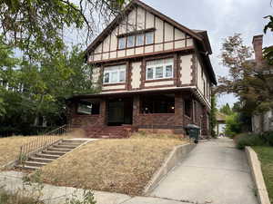 Tudor-style house with brick siding