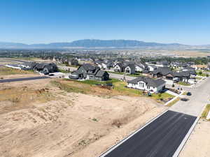 Aerial view of residential area featuring a mountain backdrop