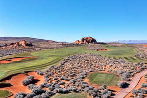 View of mountain backdrop with a golf course