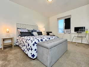 Bedroom with carpet and a textured ceiling
