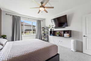 Bedroom featuring carpet flooring and a ceiling fan