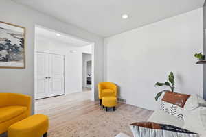 Sitting room featuring wood finished floors and recessed lighting