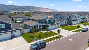 Aerial view of residential area featuring a mountainous background