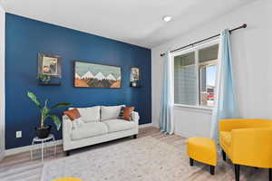 Living room with wood finished floors and baseboards