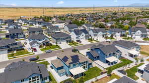 Aerial perspective of suburban area featuring a mountain backdrop