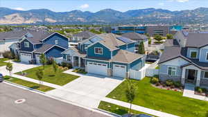 Aerial perspective of suburban area with a mountainous background