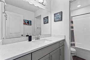 Full bathroom featuring vanity and shower / bath combo